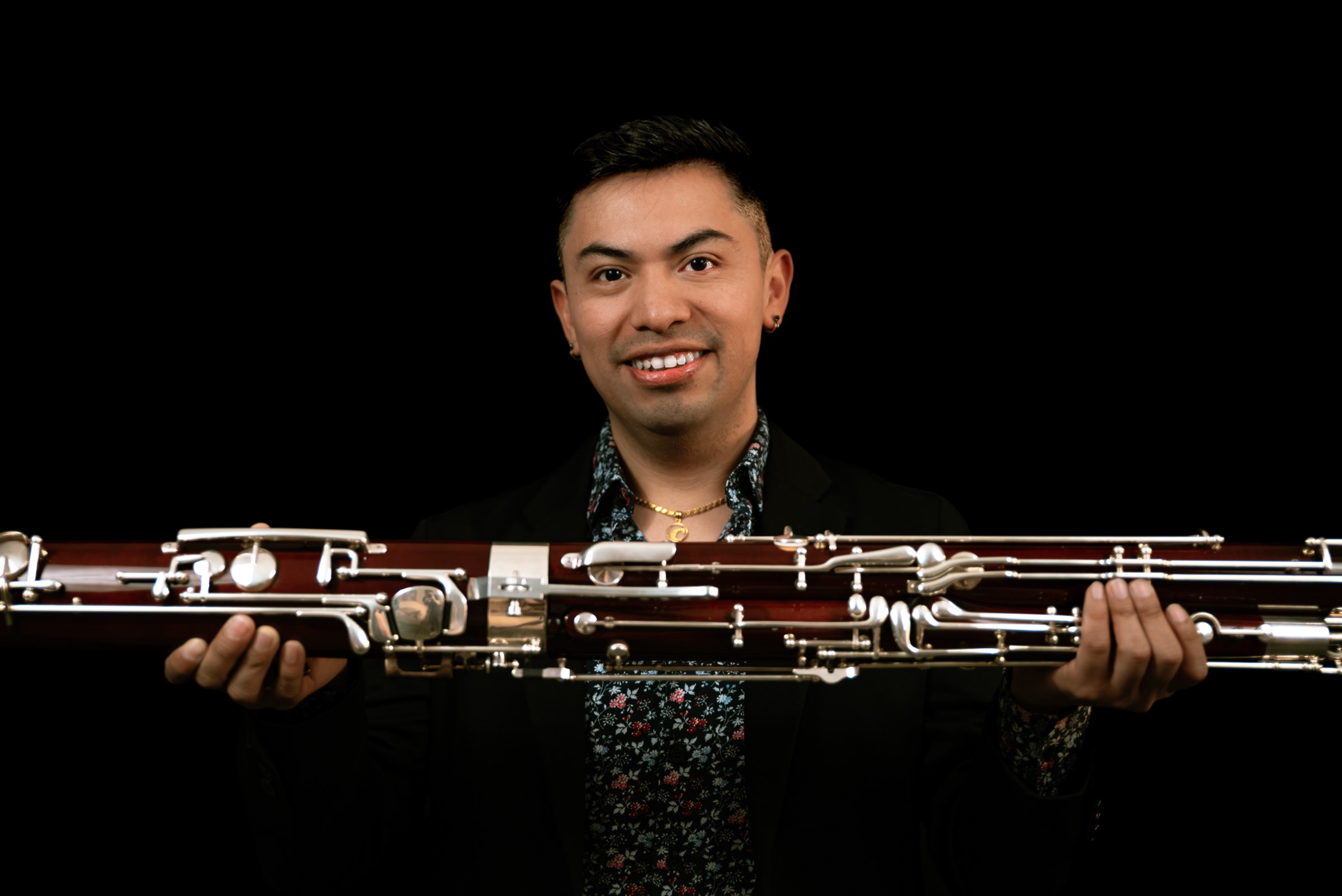 Carlos Herrera holding a bassoon
